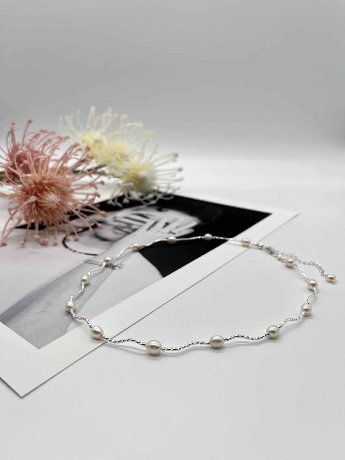 Collier „Perlenwelle“ in Silber mit echten Süßwasserperlen